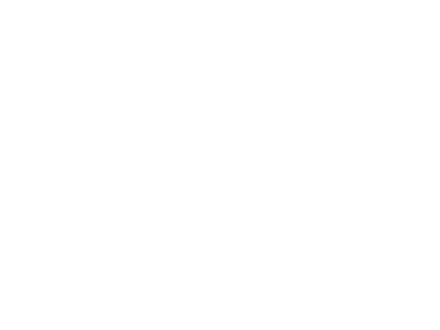 A small gear turning a large gear with a check mark in the center 